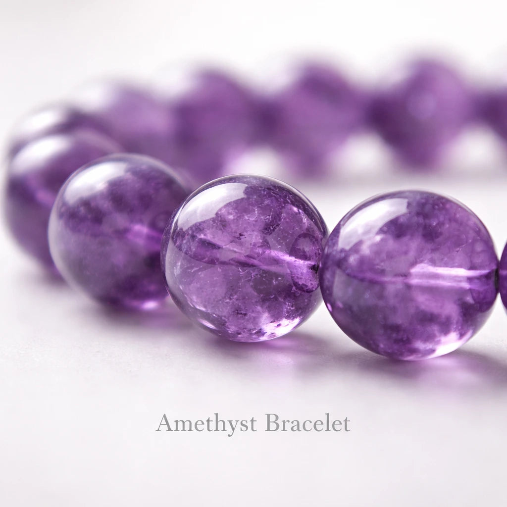 Macro close up of amethyst bracelet beads showing natural crystal texture and purple gemstone details