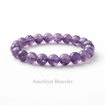 Premium amethyst crystal bracelet with round purple beads placed on clean white background realistic product photography