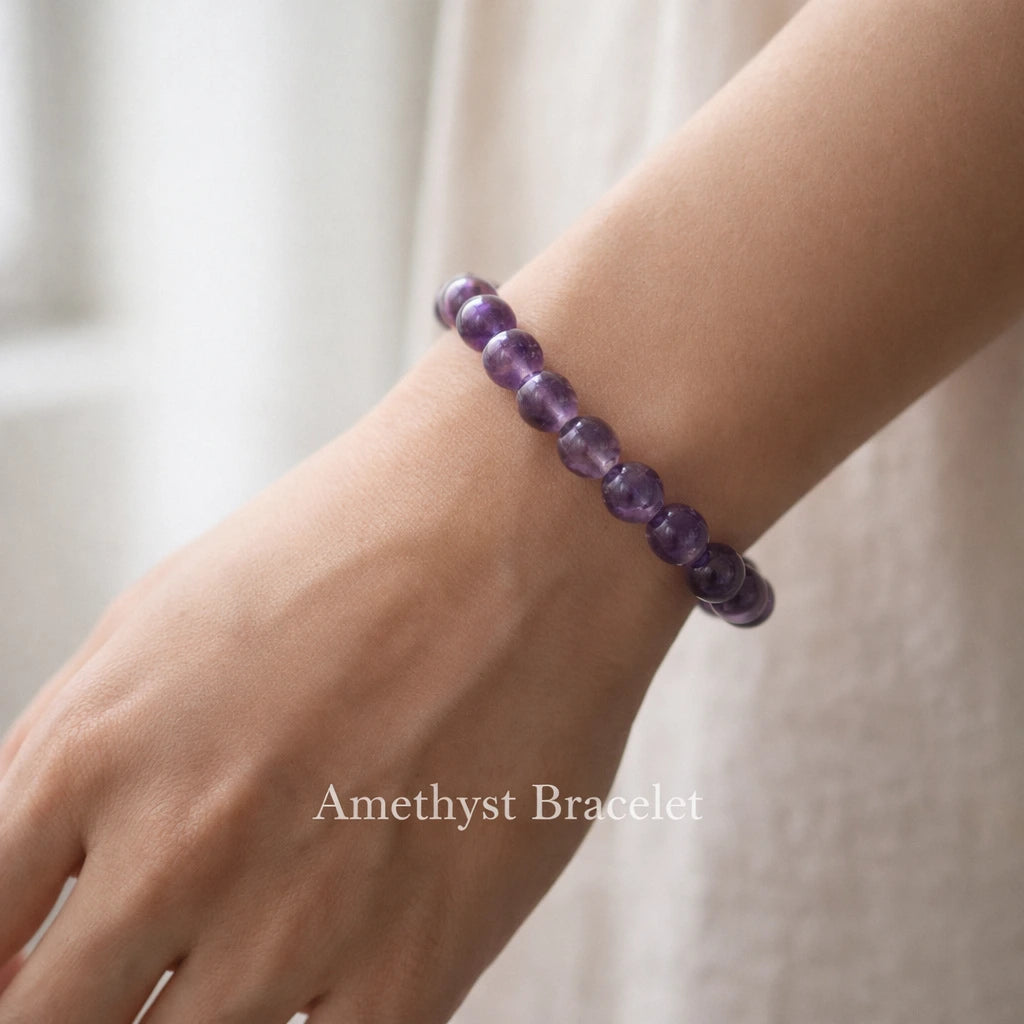 Person wearing amethyst crystal bracelet on wrist in natural light premium lifestyle jewelry photography