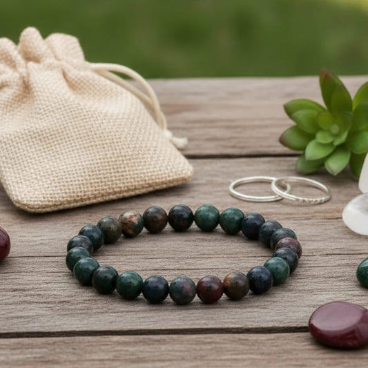 Close-up of 8mm authentic Bloodstone beads showing natural red spots and mineral patterns.